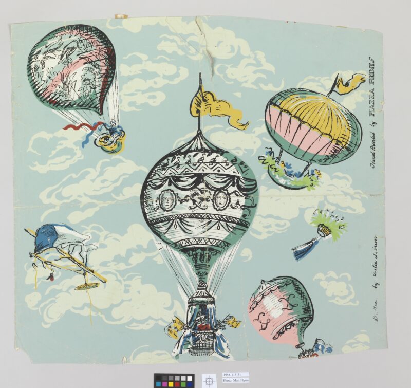 A light blue section of decorative wallpaper depicting theatrical hot air balloons with flags and curtains.