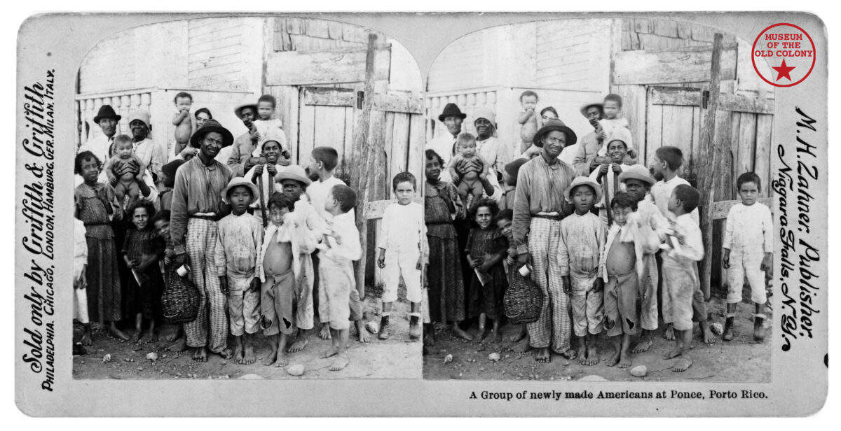 A diptych black-and-white historical photograph of individuals young and old. A typed caption reads, "A group of newly made Americans at Ponce, Porto Rico." In the upper right hand corner, there is a red circle around a star with "Museum of the Old Colony" typed in serif font.