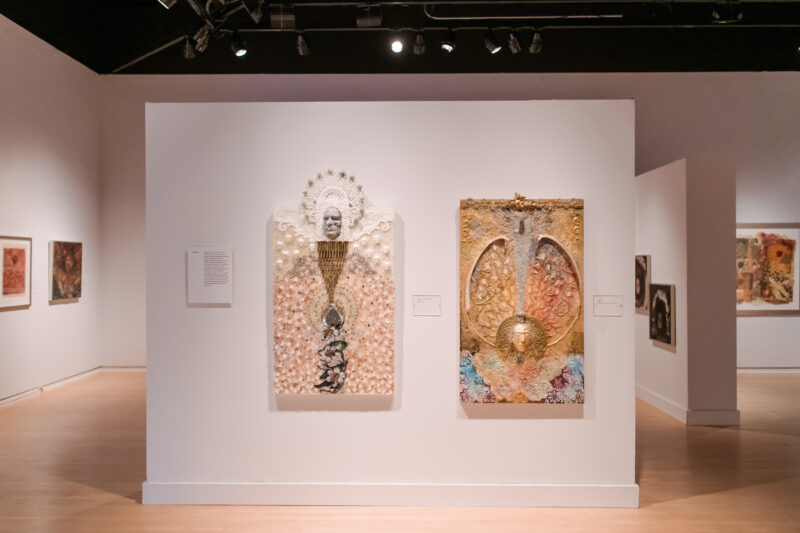 Installation view of Oletha DeVane: Spectrum of Light and Spirit. Two light-colored mixed-media works hang on the white gallery wall.