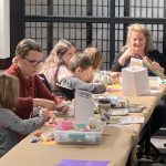 An image of families creating their own museums in the "Make Your Own Museum" Kids Club Craft event at OCA Mocha.